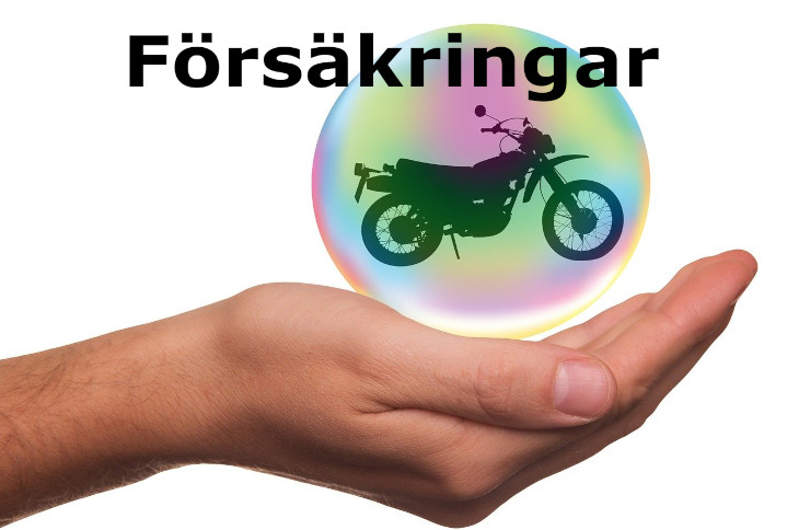 En hand som håller en motorcykel